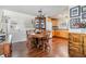 Bright dining area featuring hardwood floors, a dining table, and a view of the kitchen at 4851 W Gandy Blvd # B3L35, Tampa, FL 33611