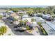 Charming manufactured home featuring mature palms, covered parking, and a welcoming pink door at 4851 W Gandy Blvd # B3L35, Tampa, FL 33611