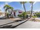 Attractive home with a quaint porch and a covered carport, surrounded by tropical landscaping at 4851 W Gandy Blvd # B3L35, Tampa, FL 33611