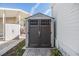 Exterior shot of storage shed with double doors and brick paver base at 4851 W Gandy Blvd # B3L35, Tampa, FL 33611