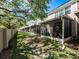 Exterior view of screened in patios along the backyard of the home at 4910 Pond Ridge Dr, Riverview, FL 33578