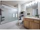 Cozy bathroom features a shower/tub combo and single vanity sink with cabinet storage at 4910 Pond Ridge Dr, Riverview, FL 33578