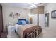 Bright bedroom with vaulted ceilings, white trim and white metal bedframe at 4910 Pond Ridge Dr, Riverview, FL 33578