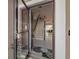 Inviting foyer with white tile floors, staircase, and open doorway to the living room at 4910 Pond Ridge Dr, Riverview, FL 33578