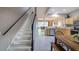 Hallway with a view of the staircase, the kitchen, and the living room at 4910 Pond Ridge Dr, Riverview, FL 33578