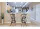 Kitchen with stainless appliances and an open concept design flowing into the staircase at 4910 Pond Ridge Dr, Riverview, FL 33578