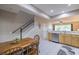 Open concept kitchen with stainless steel appliances and dining space next to staircase at 4910 Pond Ridge Dr, Riverview, FL 33578