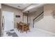 Cozy kitchen with stainless steel appliances, dining area, and staircase access at 4910 Pond Ridge Dr, Riverview, FL 33578