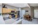 Well-lit kitchen with stainless steel appliances, light wood cabinets, and an adjacent dining area at 4910 Pond Ridge Dr, Riverview, FL 33578