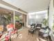 Comfortable screened in patio with stylish furniture and view to the interior at 4910 Pond Ridge Dr, Riverview, FL 33578