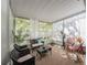 Light and airy screened patio with a variety of comfortable seating options at 4910 Pond Ridge Dr, Riverview, FL 33578