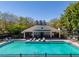 Community pool and clubhouse with lounge chairs for residents to enjoy on sunny days at 4910 Pond Ridge Dr, Riverview, FL 33578