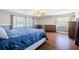 Bright bedroom boasts hardwood floors, large windows, and neutral paint, creating a serene and inviting space at 498 Lakewood Dr, Brandon, FL 33510