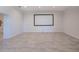 Spacious bonus room with tile flooring, ideal for entertainment or recreation, enhancing the home's versatility at 498 Lakewood Dr, Brandon, FL 33510