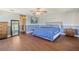 Spacious main bedroom featuring hardwood floors, neutral decor, and ensuite bathroom at 498 Lakewood Dr, Brandon, FL 33510