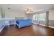 Spacious main bedroom featuring hardwood floors, neutral decor, and large windows at 498 Lakewood Dr, Brandon, FL 33510