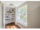 Pantry with wire shelves providing ample storage space and large window view at 498 Lakewood Dr, Brandon, FL 33510