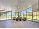 Bright sunroom furnished with comfortable seating and panoramic views at 498 Lakewood Dr, Brandon, FL 33510