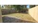 Spacious backyard with lawn and tall fence at 522 Mclennan St, Clearwater, FL 33756