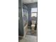 Well-lit bathroom with tiled floor and shower, featuring a classic toilet and ample natural light at 522 Mclennan St, Clearwater, FL 33756