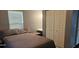 Comfortable bedroom with carpet, ceiling fan, and spacious closet providing ample storage at 522 Mclennan St, Clearwater, FL 33756