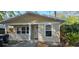 Inviting exterior of charming home, featuring a cozy front porch and well-maintained siding at 522 Mclennan St, Clearwater, FL 33756