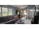 The inviting living room boasts wood-look tile flooring, and is open to the kitchen and a bright front door at 522 Mclennan St, Clearwater, FL 33756