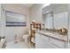 Cozy bathroom with a granite countertop sink, toilet and shower at 5420 Cicerone St # 103, Sarasota, FL 34238