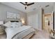 Bedroom with neutral tones, a ceiling fan, and closet space at 5420 Cicerone St # 103, Sarasota, FL 34238
