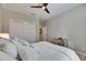 Well-lit bedroom with a ceiling fan and carpet floors at 5420 Cicerone St # 103, Sarasota, FL 34238