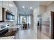 Cozy breakfast nook featuring a stainless steel refrigerator and modern lighting at 5420 Cicerone St # 103, Sarasota, FL 34238