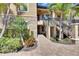Charming condo entrance featuring stone accents, manicured landscaping, and inviting steps at 5420 Cicerone St # 103, Sarasota, FL 34238