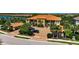 Beautiful condominium building featuring a tile roof, convenient parking, and landscaping at 5420 Cicerone St # 103, Sarasota, FL 34238