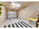 Clean and organized garage features ample space, potential for storage, and well-lit interiors at 5420 Cicerone St # 103, Sarasota, FL 34238
