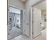 Hallway featuring access to a bedroom and a bathroom at 5420 Cicerone St # 103, Sarasota, FL 34238