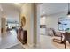 Inviting hallway with views of the kitchen and living area at 5420 Cicerone St # 103, Sarasota, FL 34238