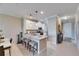 Kitchen island with seating, granite countertop, and pendant lighting, perfect for entertaining at 5420 Cicerone St # 103, Sarasota, FL 34238