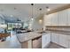 Open kitchen with granite countertops, stainless steel appliances, and view of the outdoor area at 5420 Cicerone St # 103, Sarasota, FL 34238