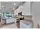 Modern kitchen with stainless steel appliances, white cabinetry, and granite countertops at 5420 Cicerone St # 103, Sarasota, FL 34238