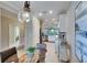Open concept kitchen with stainless steel appliances, tile flooring and modern lighting fixture at 5420 Cicerone St # 103, Sarasota, FL 34238
