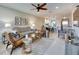 Cozy living room with plush seating and views to dining area at 5420 Cicerone St # 103, Sarasota, FL 34238