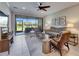Comfortable living room with a ceiling fan and sliding door access to a patio at 5420 Cicerone St # 103, Sarasota, FL 34238