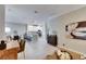 Spacious living space with kitchen, dining area, and decoratively furnished room for entertaining at 5420 Cicerone St # 103, Sarasota, FL 34238