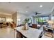 Spacious living area with modern decor, leading to outdoor balcony at 5420 Cicerone St # 103, Sarasota, FL 34238