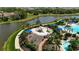 Aerial view of the neighborhood playground with a swing and slide, surrounded by shady trees and lush landscaping at 5420 Cicerone St # 103, Sarasota, FL 34238