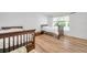 Bedroom featuring wood-look flooring and two twin beds in a naturally lit room at 5473 Blue Heron Ln, Wesley Chapel, FL 33543