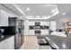Updated kitchen boasts stainless steel appliances and stone countertops providing a functional cooking space at 5473 Blue Heron Ln, Wesley Chapel, FL 33543