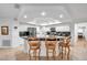 Well-lit kitchen featuring an island with seating and modern appliances blending style and functionality at 5473 Blue Heron Ln, Wesley Chapel, FL 33543