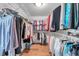 Spacious walk-in closet with built-in shelving and ample storage for organized wardrobe management at 5473 Blue Heron Ln, Wesley Chapel, FL 33543