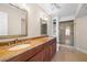 Bathroom featuring double sinks with granite countertops and a glass-enclosed shower at 6061 Bahia Del Mar Blvd # 112, St Petersburg, FL 33715